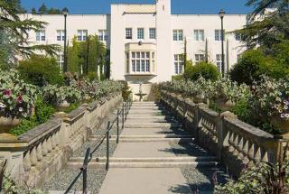 Concrete staircase leading up to a tall white building at Royal Roads