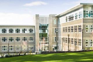 The Sequioa building resting on a rolling green hill at Royal Roads Univeristy