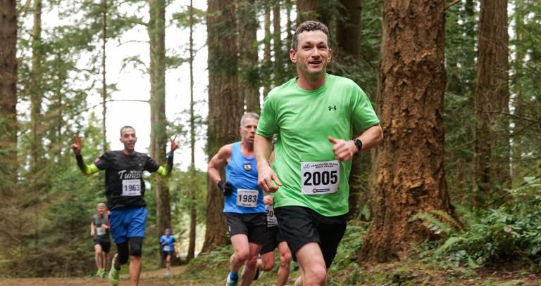 People running in forest
